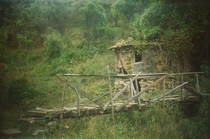 An old abandoned house with a small bridge in a Bulgarian village