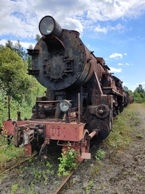 An old steam locomotive found behind a steam locomotive park in central Finland 
