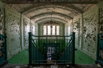 An ornate stairwell inside an abandoned school