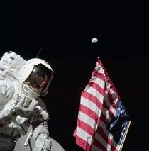 Apollo s first EVA Harrison Schmitt with the American flag and Earth in the background