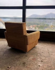 Armchair in an abandoned hotel with a beautiful view