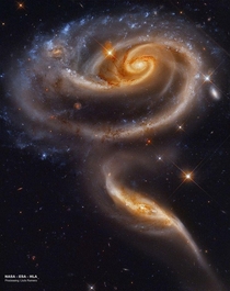 Arp  is a pair of interacting galaxies lying  million light years away in the constellation Andromeda  Hubble Legacy Archive ESA NASA Processing Llus Romero
