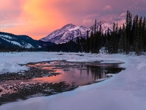 Beautiful light at a remote frozen lake in Jasper National Park 