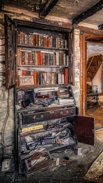 Bookcase in an abandoned house England 