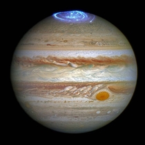 Bright blue auroras shine in Jupiters atmosphere Photo by Hubble Space Telescope 