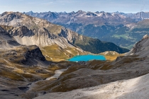 Bright Turquoise lake close to northern Italys highest mountain pass x OC