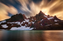 Burst - Long exposure of Broken Top OR with clouds quickly rolling up over the mountain as the sun sets behind 