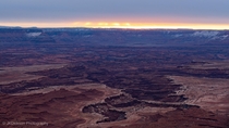 Canyonlands National Park Utah at sunrise on a mostly cloudy winter day 