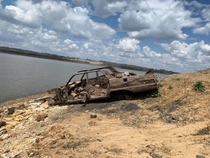Car emerged from the water as the lake level dropped