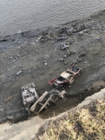 Car graveyard at the bottom of a cliff KGB road Wasilla Alaska