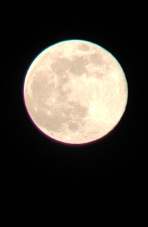 Caught the moon with my phone through a Celestron SkyMaster 