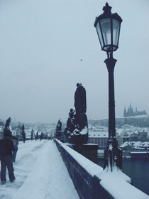 Charles Bridge And Prague Castle on a snowy morning 