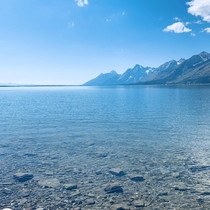 Clear lake and mountains outside of Grand Teton National Park 