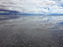 Cloud reflection on the biggest salt flat in the world - Salar de Uyuni Bolivia x