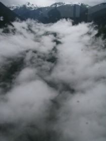Clouds nestled in a valley 