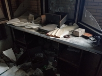 Cluttered desk in an derelict factory