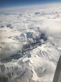 Coast range mountains peek through the clouds British Columbia 