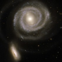 Colliding galaxies NGC  the large spiral and NGC  the smaller companion 
