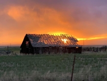 Colorado sunset behind an abandoned barn
