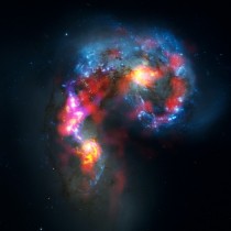 Composite image from ALMA and Hubble observations of the interacting Antenna Galaxies NGC  and  The ALMA observation allows us to see the massive concentrations of gas within their centers and the region where theyre colliding 