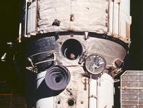 Cosmonaut looks out window on the Mir space station