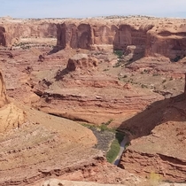Coyote Gulch Utah casually looking over a  drop