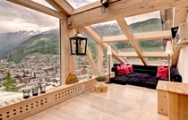 Cozy wooden panelled window walls and roof in luxury cabin rooftop  Switzerland