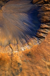 Crisp Crater in Sirenum Fossae Mars by NASAJPL-CALTECHUNIVERSITY OF ARIZONA