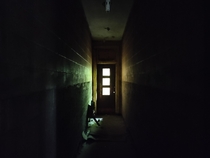 Dark and claustrophobic hallway in an abandoned elementary school