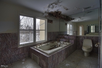 Decaying Bathroom Inside an Abandoned Waterfront Mansion in Ontario 