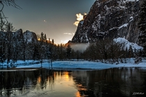 Didnt make it to Horsetail Fall in time due to road conditions but stopped here along Merced River and got this cloud glowing near the falls Yosemite National Park 
