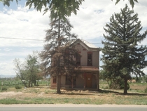 Dilapidated Boarded-Up Farmhouse Denver CO 