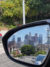 Downtown Los Angeles as seen from a car mirror 