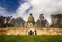 Dunmore Pineapple Scotland was built in  and was used among other things for growing pineapplesThe building is a mixture of architectural styles The south ground floor entrance takes the form of a characteristically Palladian Serliana archway incorporatin