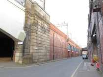 Elevated Section of Railway in Manchester England with Temperance Street Alongside it for as can be seen Some Considerable Distance 
