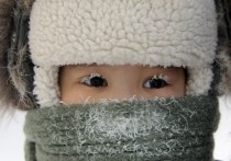 Eyelashes covered with hoarfrost in minus  degree cold Yakutsk Siberia 
