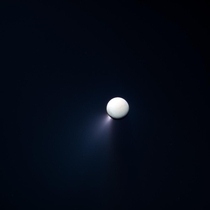 False-color view of Saturns moon Enceladus and the south polar plumes