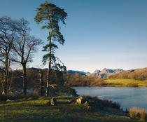 Finally a clear winters day after all the murk and cloud Loughrigg Tarn Lake District England 