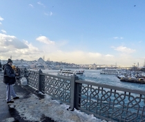 Fishing from Galata Kprs bridge in winter Istanbul Turkey 