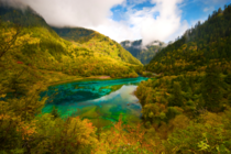 Five Flower Lake in Jiuzhaigou National Park China  by Ng Hock How
