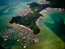 Floating Moro immigrant dwellings off the coast of Gaya Island Malaysia 