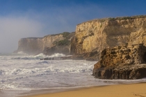 Fog beach and cliffs along the Santa Cruz coast near Davenport California 