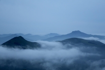 Fog engulfing my local mountains at dusk during a hike Basque Country France 
