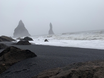 Fog rolling in at Reynisfjara Iceland Black Beach  
