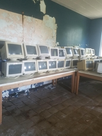 Forgotten computer monitors from an abandoned high school