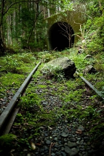 Forgotten train tracks and tunnel on the outskirts of Tokyo