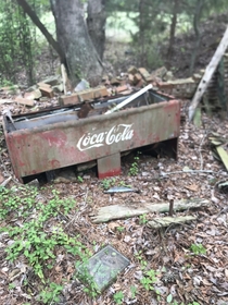 found what looks like an old Coke Machine in this abandoned barn in the woods
