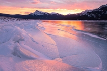 Fractured ice in Canadian Rockies  blazing sunrise 