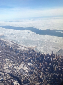 Frozen Lake Michigan amp Chicago from plane window 