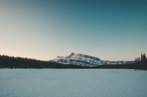 Frozen Two Jack lake at sunrise near Banff Alberta 